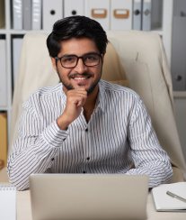 App development consultant working on a laptop